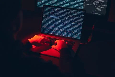 Man using computer and programming  to break code. Cyber security threat. I.. 库存照片