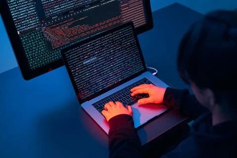 Man using computer and programming  to break code. Cyber security threat. I.. 库存照片