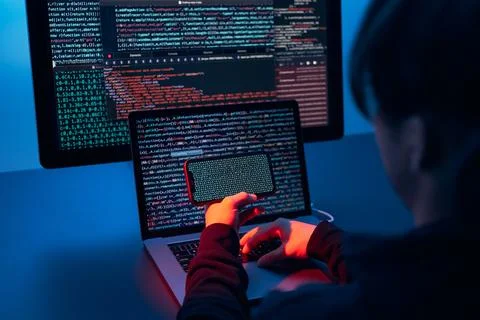 Man using computer and programming  to break code. Cyber security threat. I.. Stock Photos