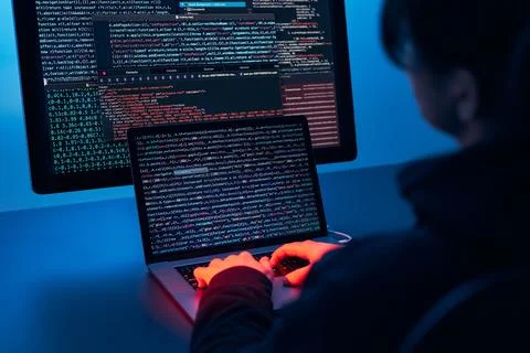 Man using computer and programming  to break code. Cyber security threat. I.. Foto stock