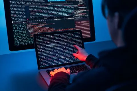 Man using computer and programming  to break code. Cyber security threat. I.. Foto stock