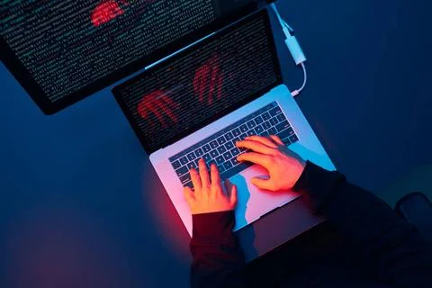Man using computer and programming to break code. Cyber security threat. I... Foto stock