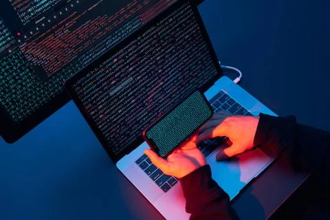 Man using computer and programming to break code. Cyber security threat. I... Stock-Fotos
