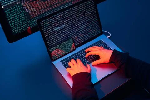 Man using computer and programming to break code. Cyber security threat. I... Stock Photos