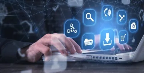 Man using computer. App icons with a download symbol. Development of applic.. Stock Photos