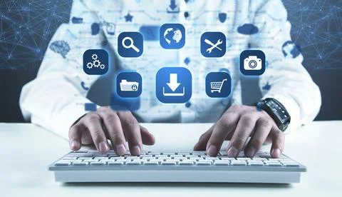 Man using computer. App icons with a download symbol. Development of applic.. Stock Photos