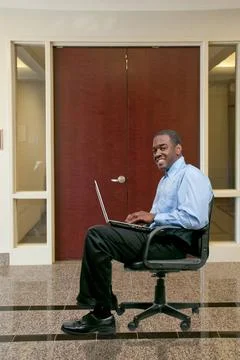 Man Using Computer A black African American man computer user ,model relea... Stock Photos