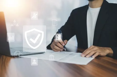 Man using  computer buy insurance online at home Stock Photos