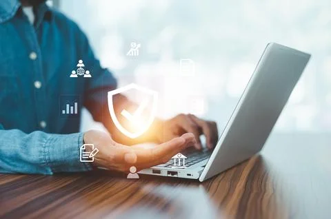 Man using  computer buy insurance online at home Stock Photos