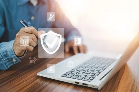 Man using  computer buy insurance online at home Stock Photos