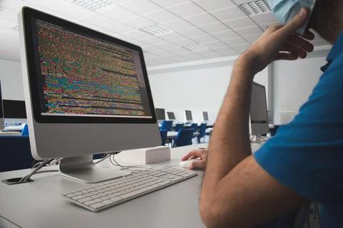 Man using a computer in a class Stock Photos