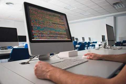 Man using a computer in a class Stockfoto's