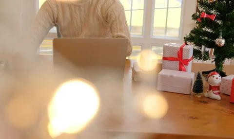Man using computer during xmas. christmas holiday new year celebration Stock-Fotos