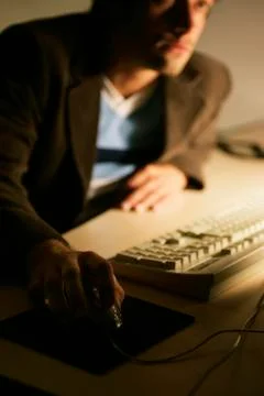 Man using a computer mouse Stock Photos