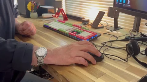 Man Using Computer Mouse at Wooden Desk Stock Footage 337515394