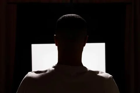 Man using computer at night, back view. Internet addiction Stock Photos