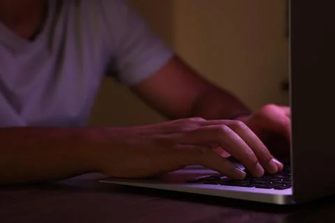 Man using computer at night, closeup. Internet addiction Stock Photos