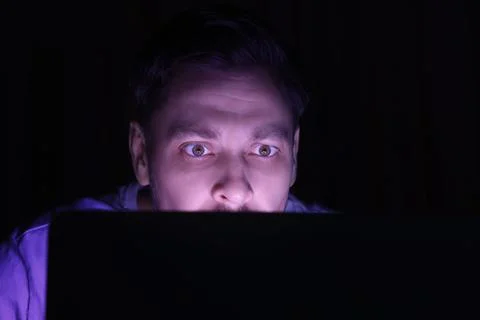 Man using computer at night, closeup. Internet addiction Stock Photos