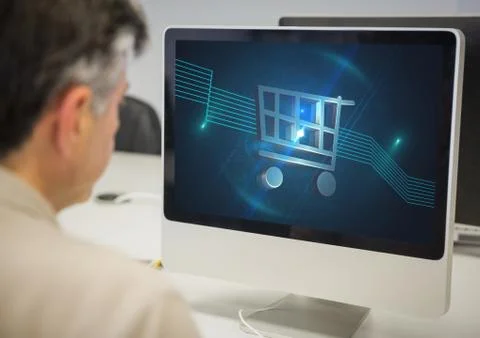 Man using Computer with Shopping trolley icon Stock Photos