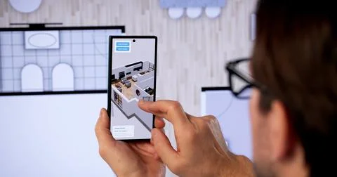 Man Using Computer Software To Design A Virtual 3D House Interior. 库存照片