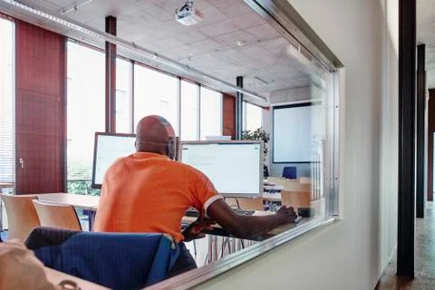 Man using computer in training room Stock Photos