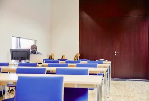 Man using computer in training room 스톡 사진