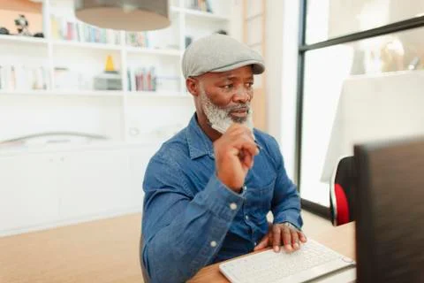 Man using computer, working in home office Foto stock