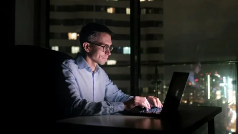 Man using contemporary notebook texting message, blurred background. oung Stock Footage 245237488