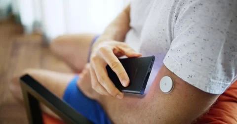 Man Using Continuous Glucose Remote Monitor Diabetes Stock Footage 242774283