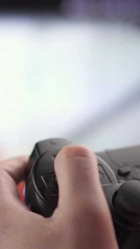 Man using a controller while playing computer game Stock-Footage 333908701