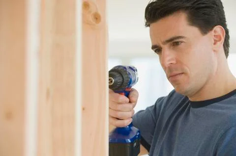 Man using cordless drill Stock Photos