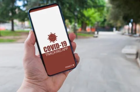 Man using a covid-19 tracking app to prevent contagion from coronavirus Stock Photos