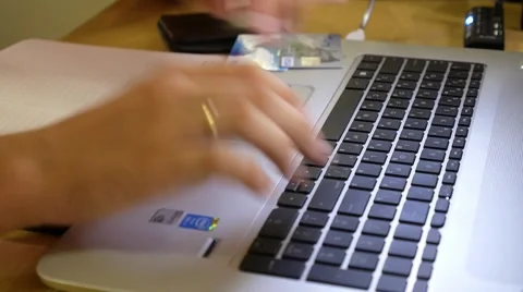 Man Using Credit Card and Laptop, Online Shopping Indoor Stock Footage 43047596
