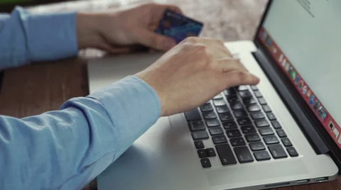 Man using credit card and computer for online shoping concept Stock Footage 61051667