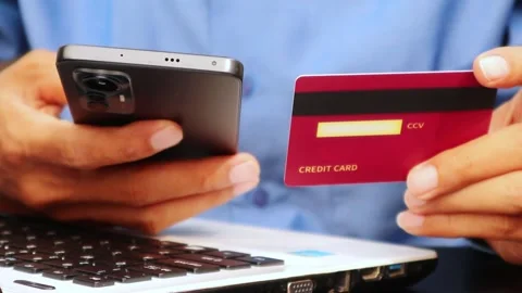 Man using credit card and smartphone for online shopping Stock Footage 310211542