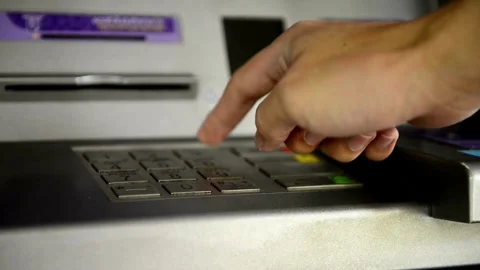 Man using credit card in an atm for cash withdrawal, entering PIN code taki.. Stock Footage 272756955