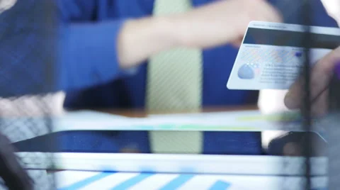 Man Using Credit Card In Office 動画素材 64052336