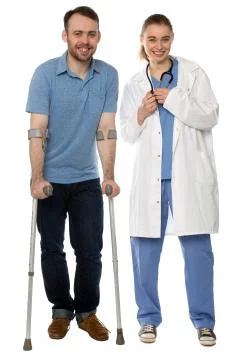 Man using crutches, next to a friendly physician Stock Photos