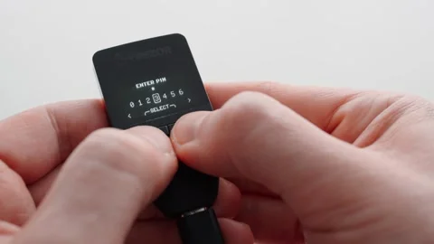 Man using a crypto hardware wallet. Entering the PIN code. Trezor Safe 3. Close 스톡 동영상 296783116