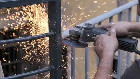 Man using cut off saw to smooth steel Stock Footage 232382382