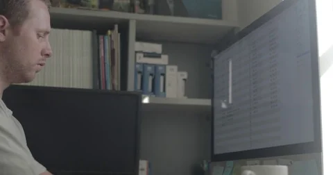 Man using desktop computer in home office Stock Footage 78037240