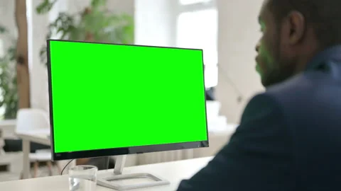 Man Using Desktop with Green Chroma Key Screen Stock Footage 146482192