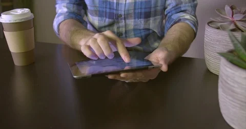 Man using a device near plants light leak version Stock Footage 85415923