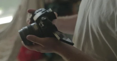 Man using digital camera at home Stock Footage 78037705