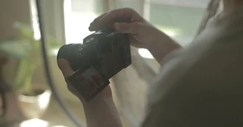 Man using digital camera at home Stock Footage 78037730