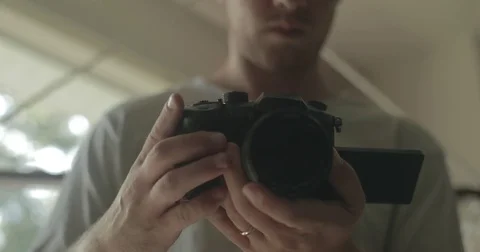 Man using digital camera at home Stock Footage 78037741