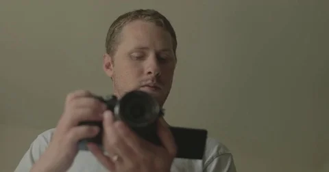 Man using digital camera at home Stock Footage 78037742