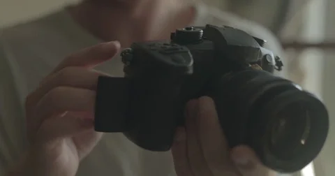 Man using digital camera at home Stock Footage 78037818