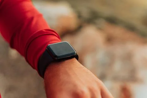 Man Using A Digital Smartwatch During Workout. Closeup View Of Man's Hands Stock Photos