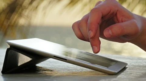 Man using digital tablet on the beach Stock Footage 52610940